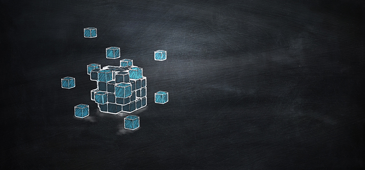 Assembled web Chalk drawing of a cube made of smaller blue blocks, with some blocks floating apart, on a blackboard background.
